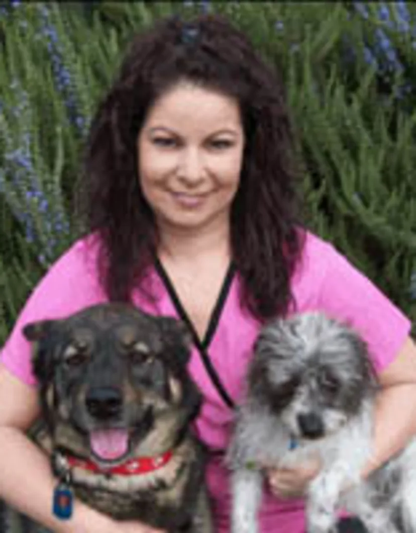 Susan holding 2 dogs